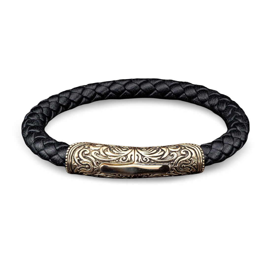 Top view of William Henry Milan bracelet with braided black leather and engraved bronze magnetic clasp on white background