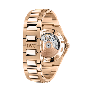 Rose-gold IWC bracelet and exhibition caseback showing rotor, serial 2345678, 10 BAR, INTERNATIONAL, MADE IN SWITZERLAND