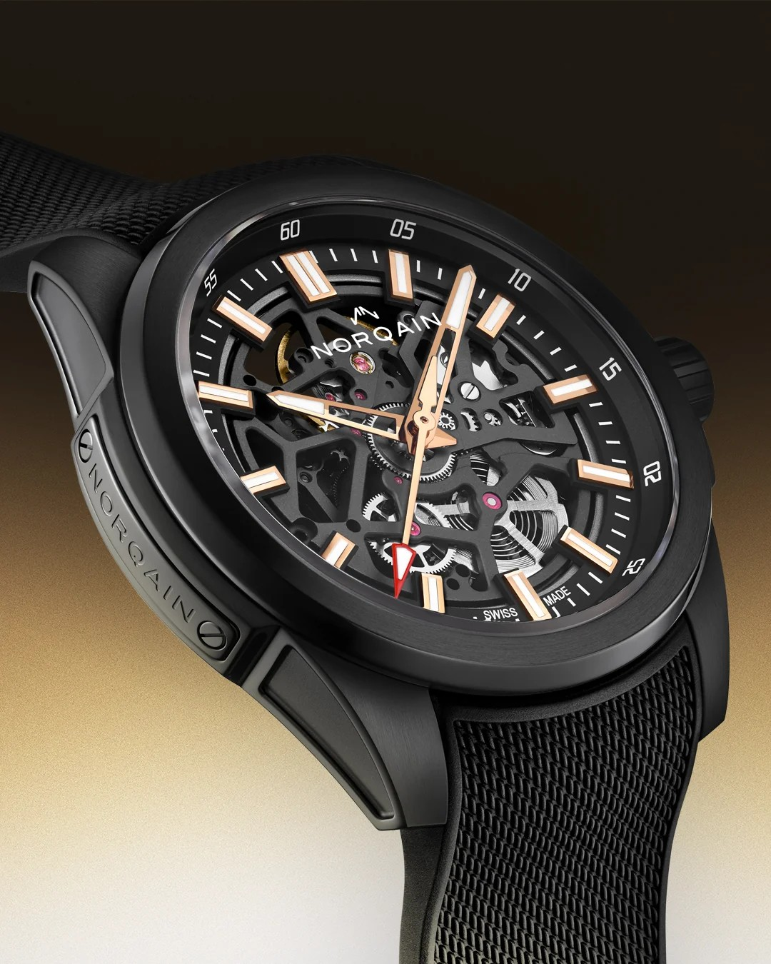 A close-up studio shot of a NOROAIN skeleton watch with a black case, black mesh strap, and a black dial featuring rose-gold-toned hands and markers.