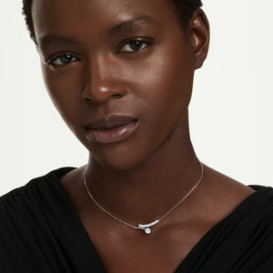 model wearing a Silver tone round stone necklace on a white background