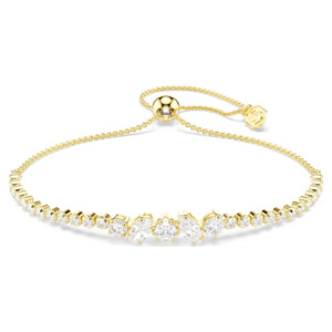 Gold tone bracelet with round and mixed cut stones on a white background