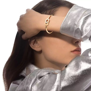 model wearing 0.11ctw Yellow Gold Diamond Bangle Bracelet