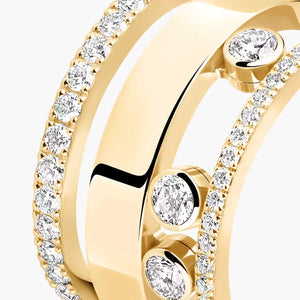Gold ring with diamond accents on a white background
