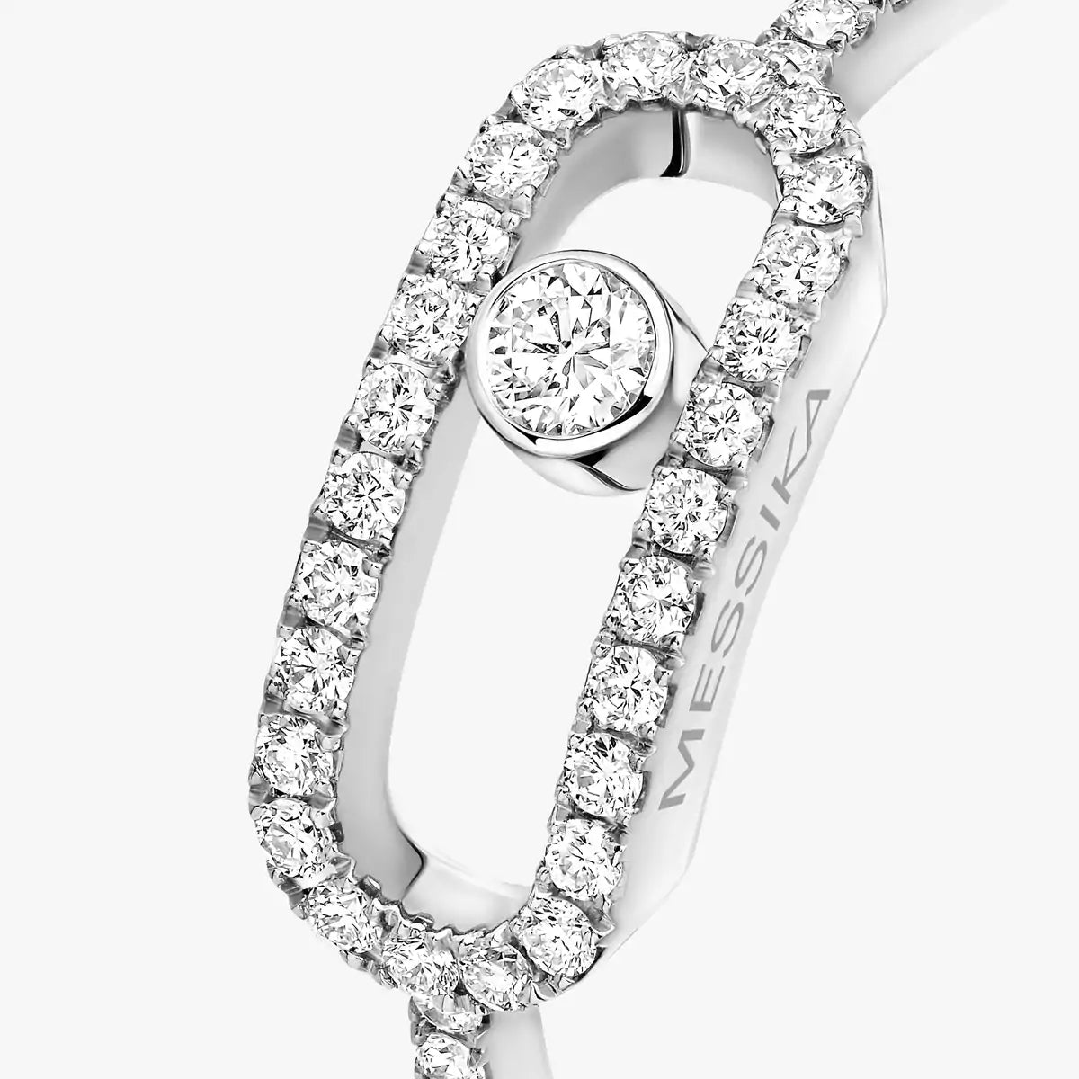 Diamond ring with 'MESSiIKA' branding on a white background