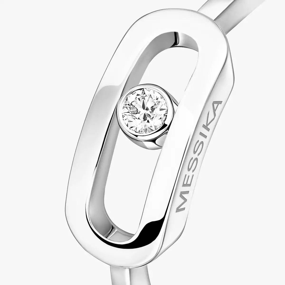 Silver ring with a diamond and 'MESSIKА' branding on a white background