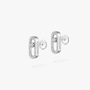 Pair of silver earrings with 'MESSIKA' branding on a white background