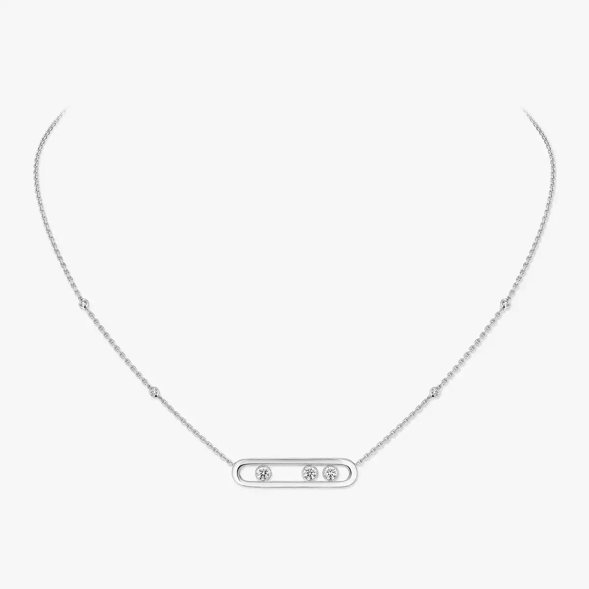 Silver necklace with small diamonds on a light gray background