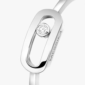 Silver ring with a diamond and 'MESSIКА' branding on a white background