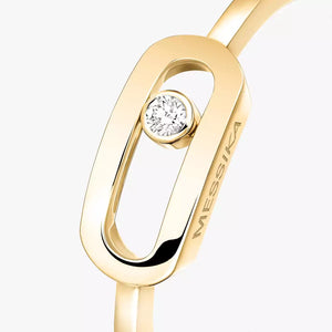 Gold ring with a diamond on a white background