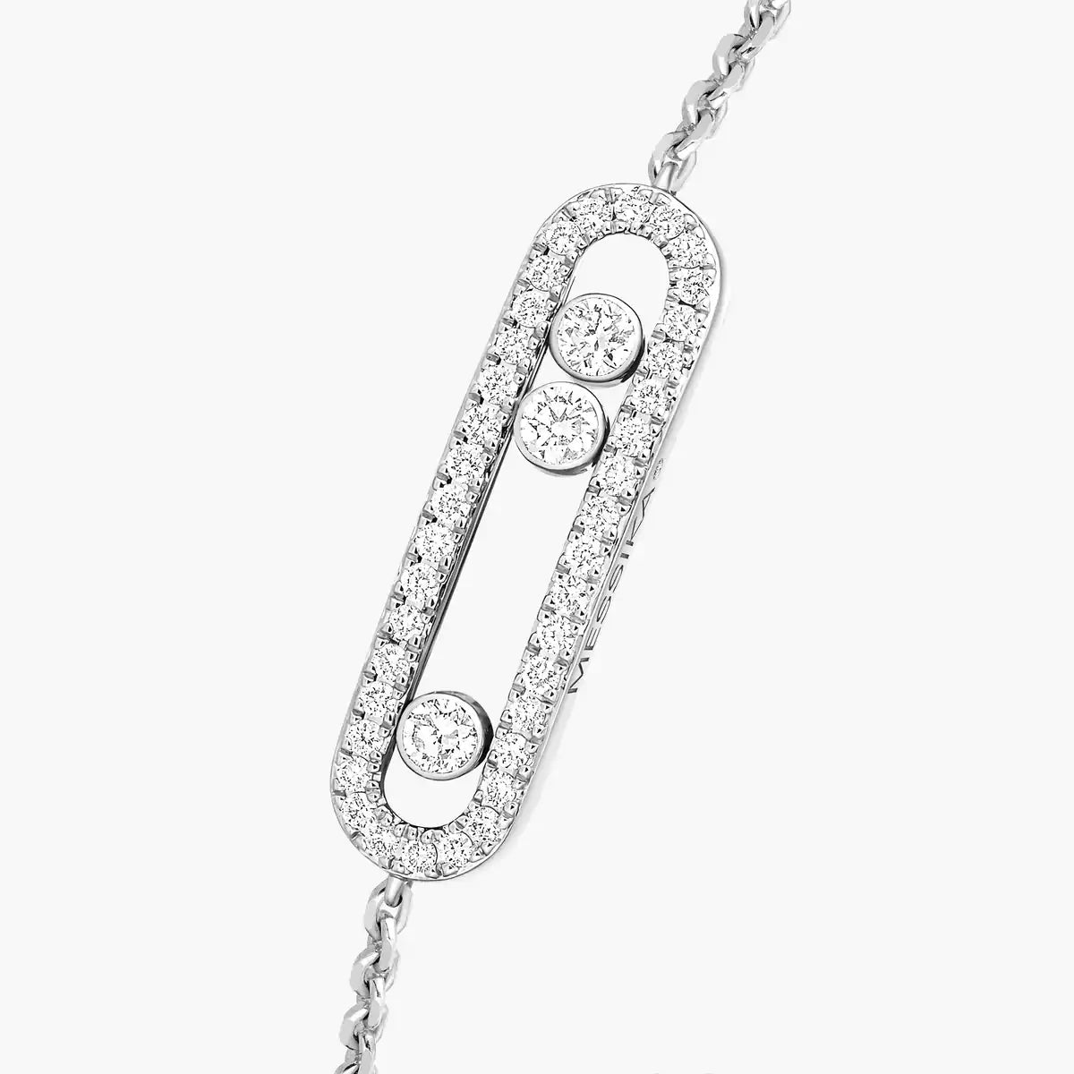 Silver bracelet with diamond pendants on a white background