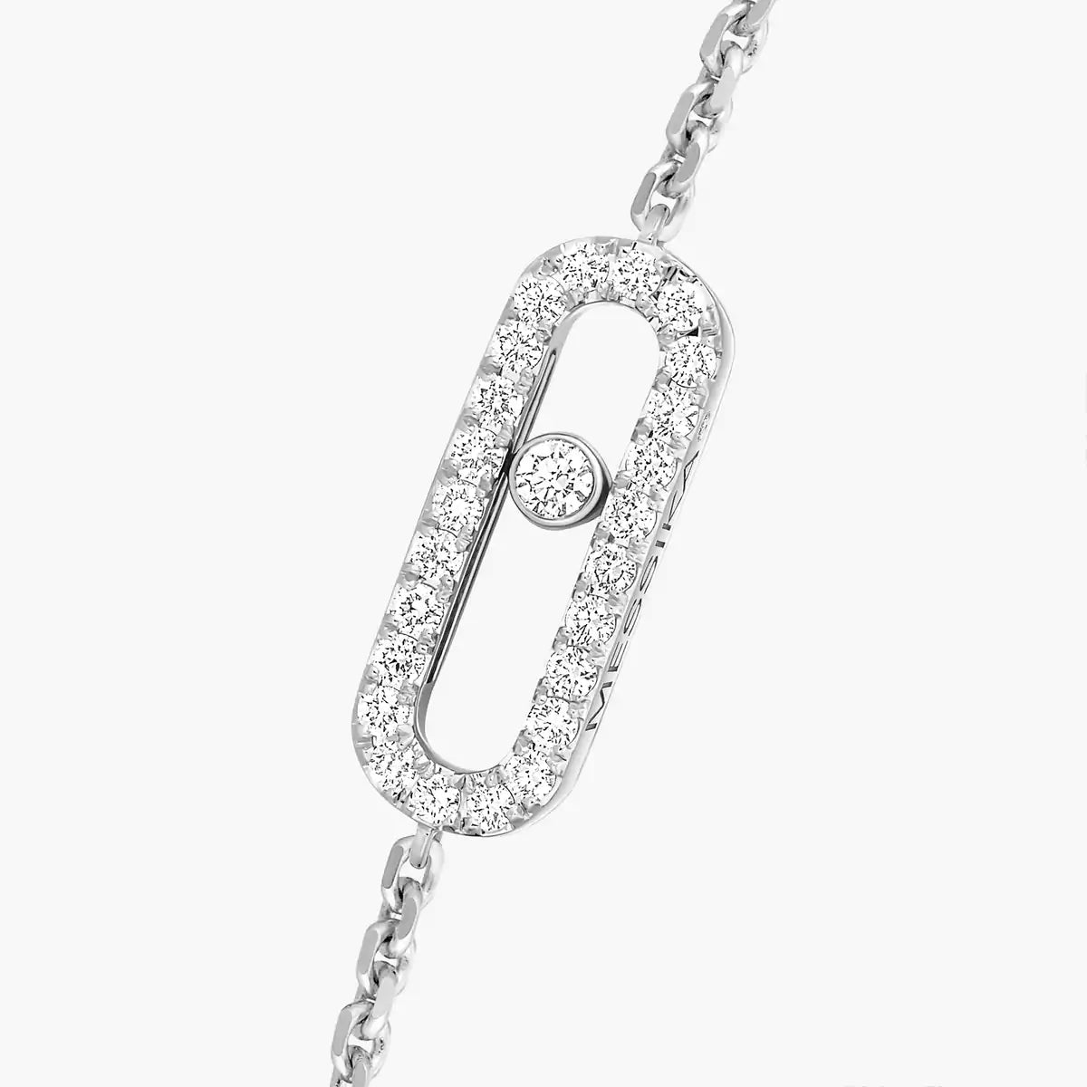 Close-up of 0.20ctw white gold diamond pave bracelet showing oval pave link with center bezel diamond