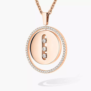yellow gold pendant necklace with diamonds on a white background