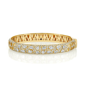 Front view of Montage Luxe pavé bangle in yellow gold showcasing mixed-cut diamonds and lattice interior on white background