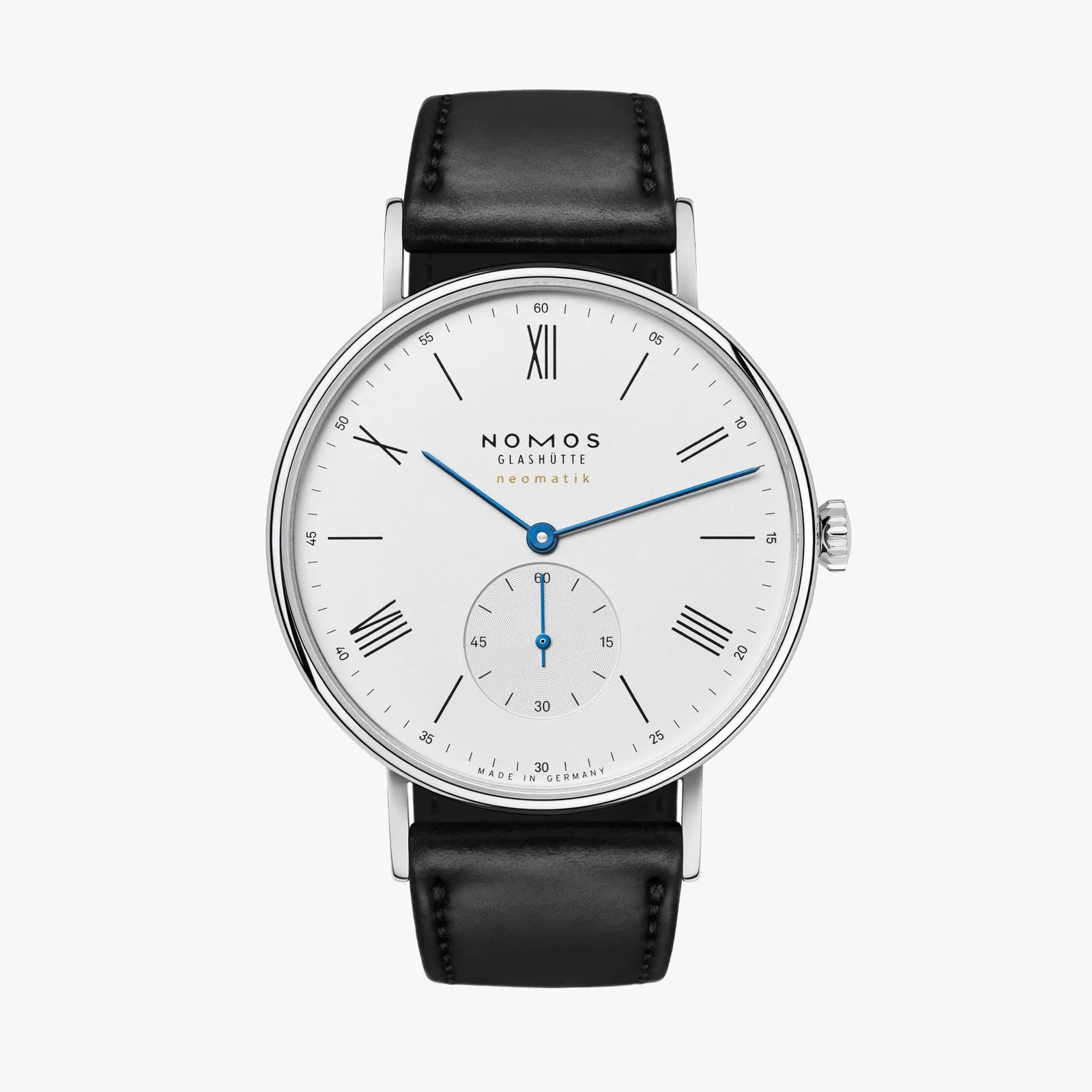 Nomos watch with black leather strap and white dial on a white background