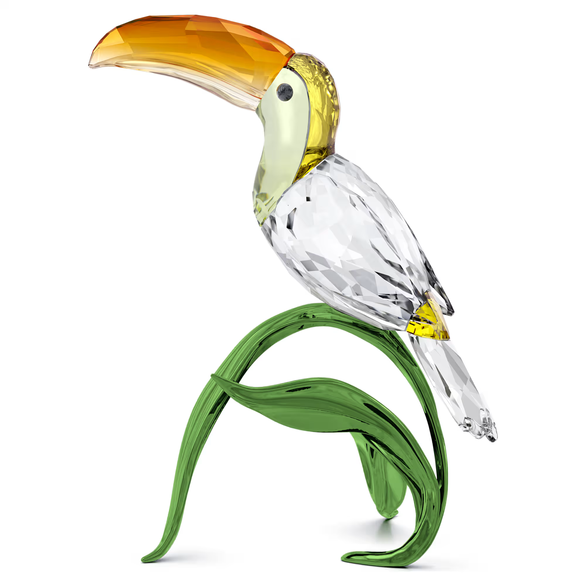 Crystal toucan sculpture with yellow-orange beak perched on a curved green-leaf base, Idyllia Toucan.