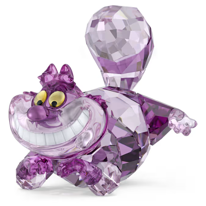Purple faceted crystal Cheshire Cat figurine with large toothy grin and yellow eyes