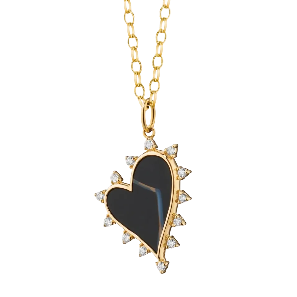 Gold necklace with black agate heart with diamonds on a white background