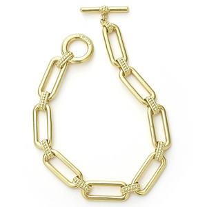 Top view of 18K gold link bracelet showcasing rectangular links with caviar beading accents and toggle clasp on white background