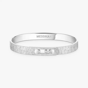 Silver bracelet with 'MESSIKА' branding on a white background