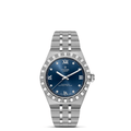 Silver Tudor watch with a blue dial on a white background