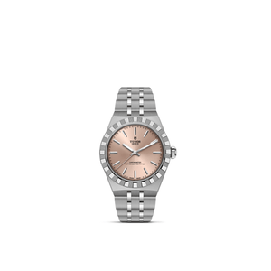 Front view of TUDOR Royal 30mm stainless steel watch showcasing salmon dial, applied stick hour markers, and 5-link bracelet on white background