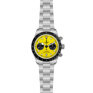 Wristwatch with a yellow face and silver bracelet on a white background