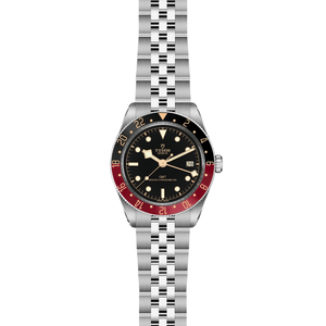 Front view of TUDOR Black Bay 58 GMT watch showcasing black dial, black-and-burgundy GMT bezel, date window and five-link stainless steel bracelet on white background