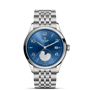 Front view of TUDOR 1926 Luna watch with blue sun-brushed dial, moonphase and date, 39mm polished steel case and bracelet on white background