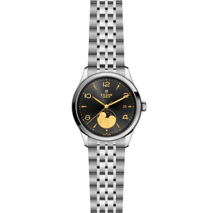 Front view of TUDOR 1926 Luna 39mm steel watch showcasing black sun brushed dial, gold numerals and moon phase on white background