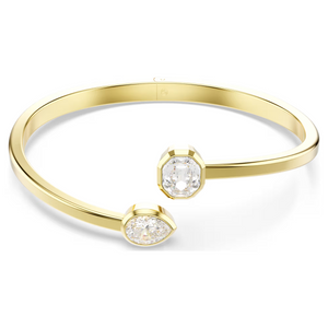 Yellow-gold open bangle with pear-shaped and octagon-cut white diamonds at each end.