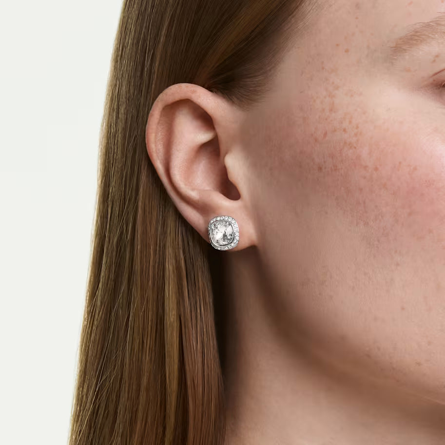 model wearing silver tone halo stud earrings on a white background