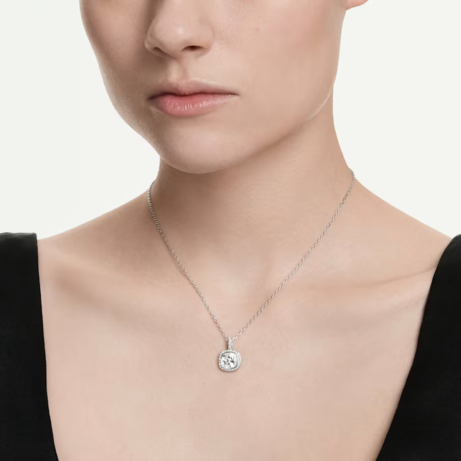  a model wearing silver tone crystal halo necklace on a white background