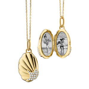 Gold shell locket with diamonds on a gold chain, holds two images