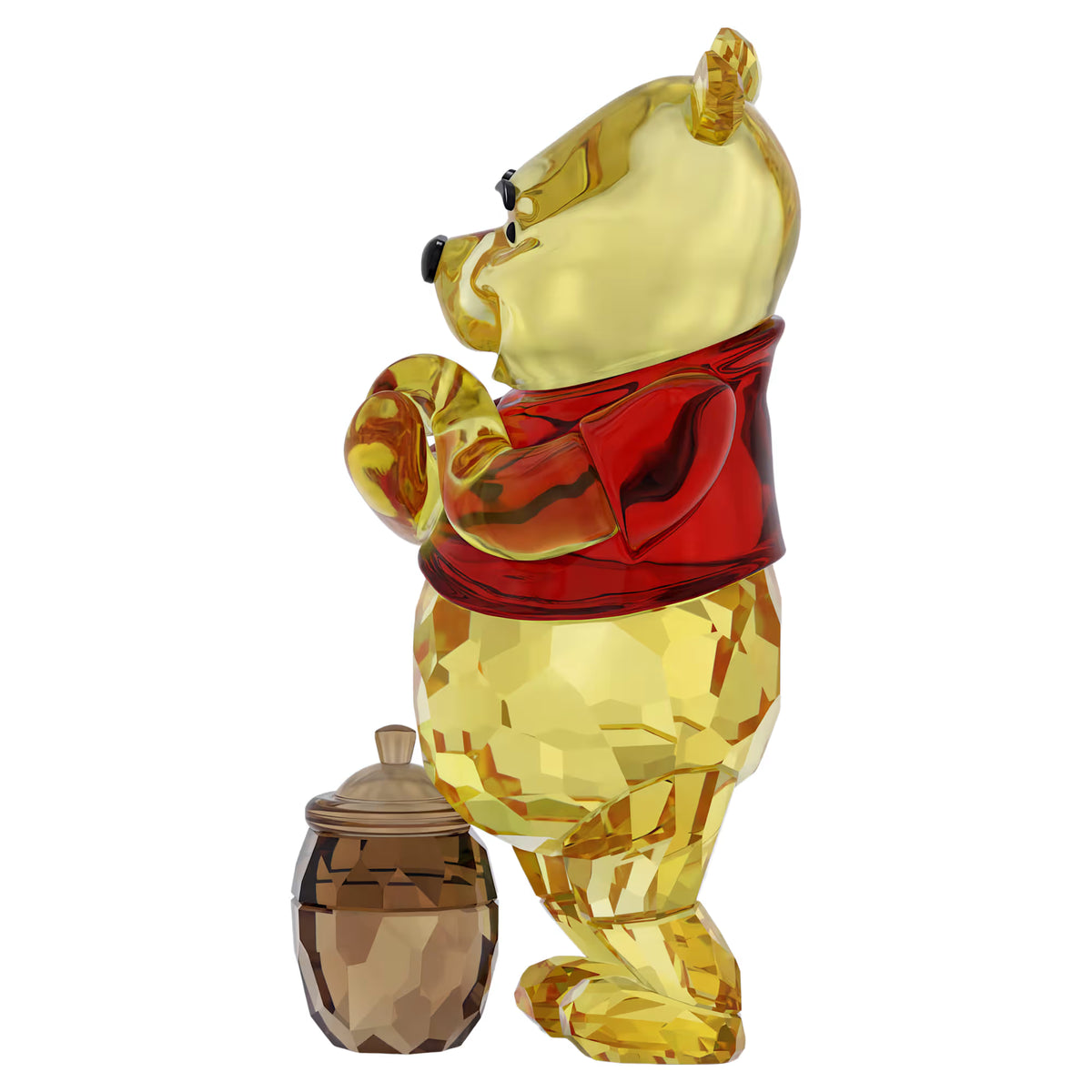 side view of winnie the pooh crystal figurine with a pot of honey by his feet on a white background