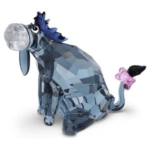 crystal figurine in dark crystals and pink box on the tail on a white background