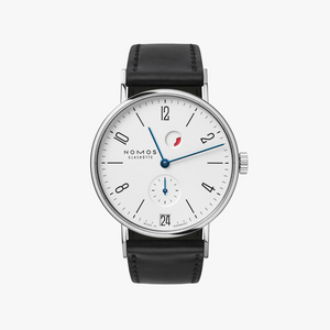 A Nomos Eliaßelter wristwatch with a white dial, silver-tone case, and black leather strap, shown against a light gray background.