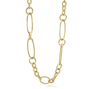 Close-up of 18K gold link necklace showing alternating elongated links and caviar-beaded chain on white background
