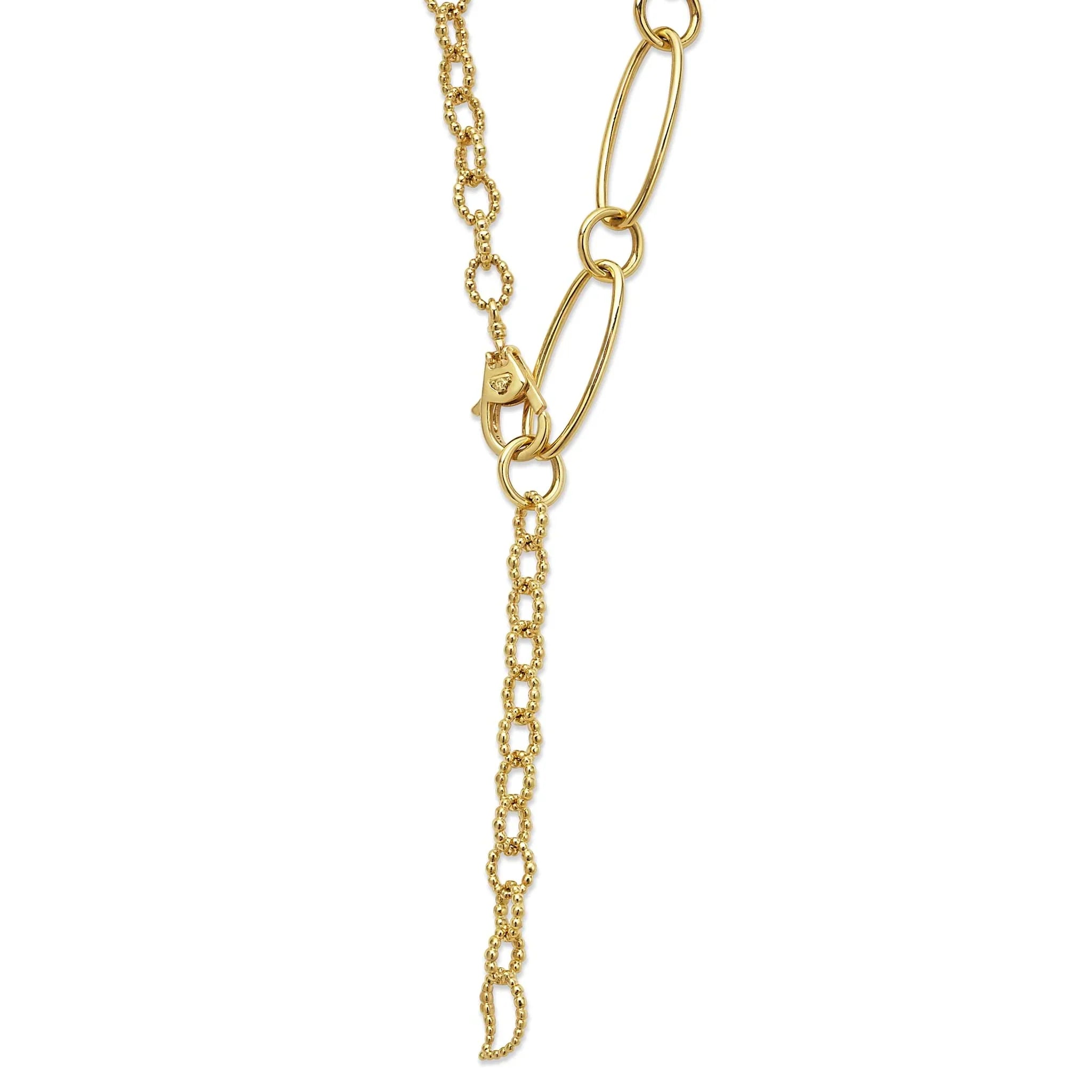 Close-up of 18k gold link necklace with oval and caviar beaded links, lobster clasp, dangling extender on white background