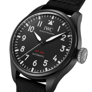 Angled view of Big Pilot's Watch 43, black ceramic case, black dial with white numerals, red TOP GUN text, black fabric strap
