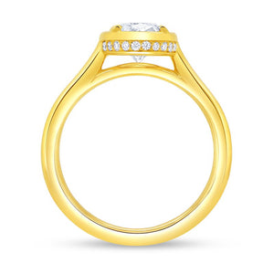 18K yellow-gold engagement ring, profile view with round center diamond set over a pavé diamond halo and polished band.
