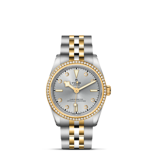 Front view of TUDOR Black Bay S and G 31mm watch with two-tone steel and yellow gold bracelet and diamond-set bezel