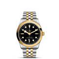Front view of TUDOR Black Bay S&G 36mm watch with black dial, yellow-gold bezel and two-tone steel and gold bracelet