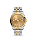 Front view of TUDOR Black Bay S and G 36 mm, champagne dial with diamond markers and two-tone steel and yellow gold bracelet