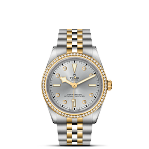 Front view of TUDOR Black Bay S&G 36mm two-tone watch showing silver dial, diamond bezel, and steel-and-gold bracelet