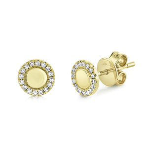 Angled view of 0.10ctw diamond stud earrings showcasing 14K yellow gold discs with diamond halo on white background