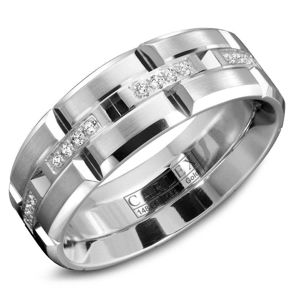 Angled view of 14K white gold brushed band showcasing channel-set round diamonds and geometric grooved pattern on white background