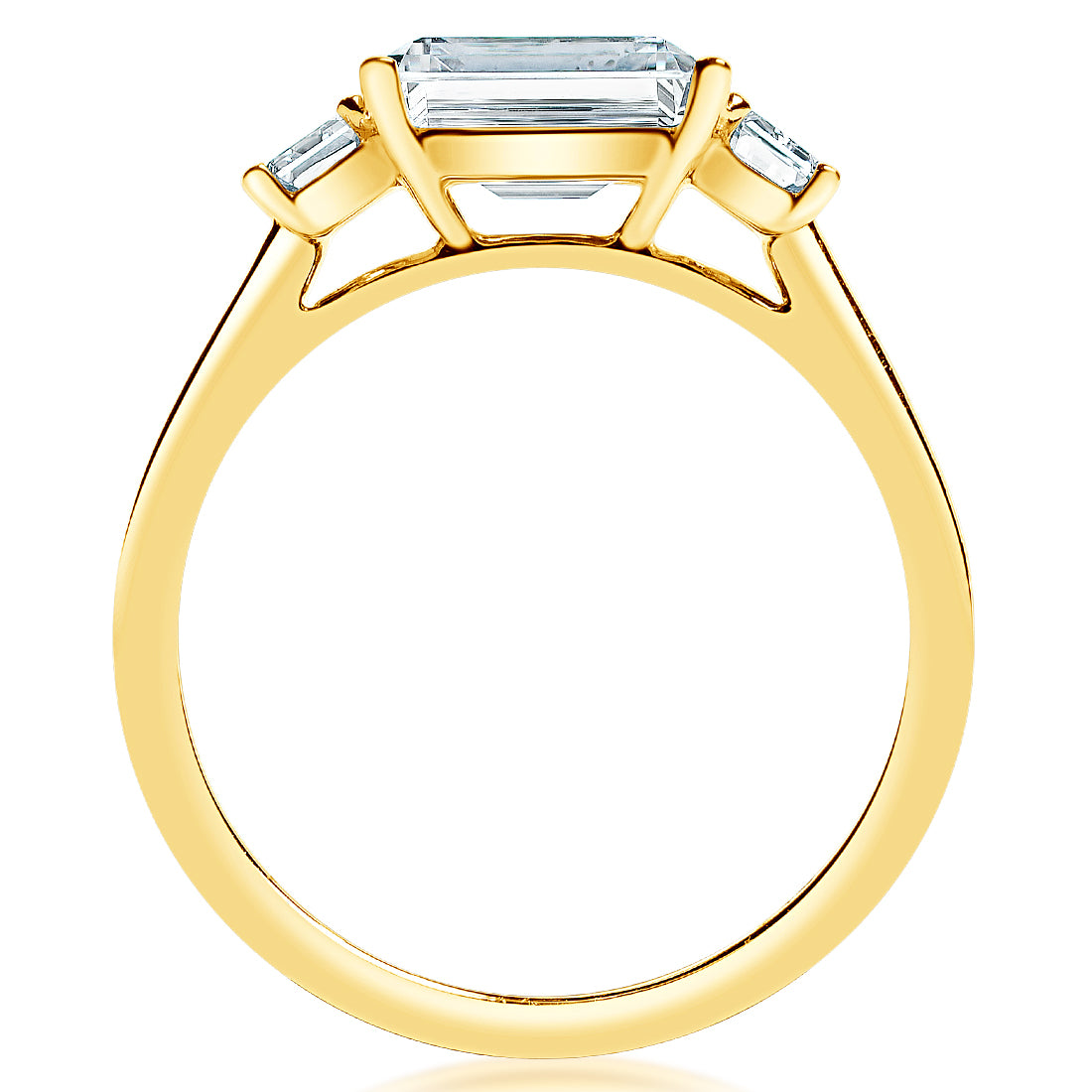 Side view of .49ctw emerald-cut diamond engagement ring showing three-stone 14K yellow gold setting on white background