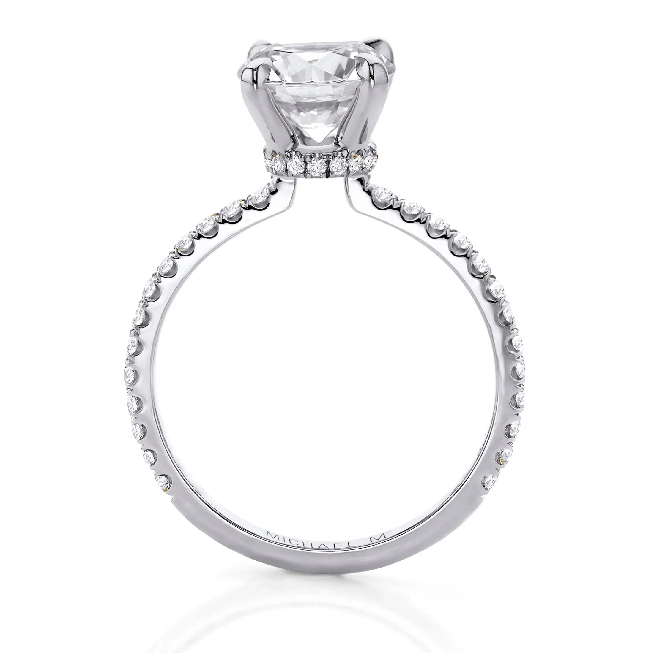 Platinum solitaire engagement ring with large round brilliant diamond in a prong setting and pavé diamond band