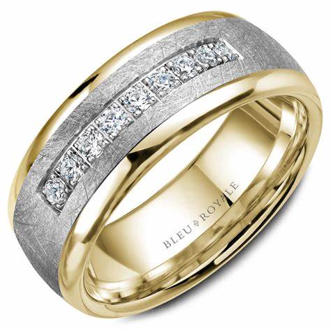 Angled view of 14K brushed white gold–finish wedding band with yellow gold edges and center channel of diamonds on white background