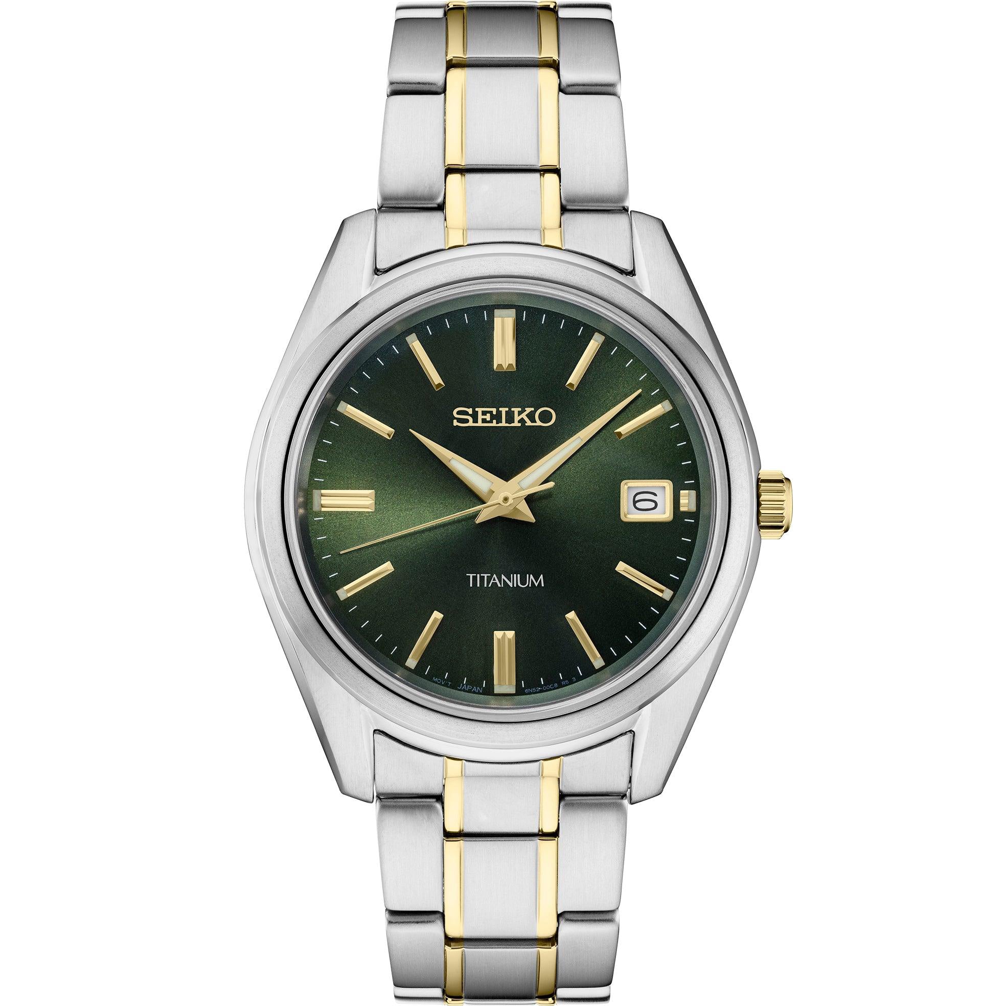 Front view of Seiko SUR377 watch with green sunburst dial, gold hands and markers, date at 3, two-tone titanium bracelet